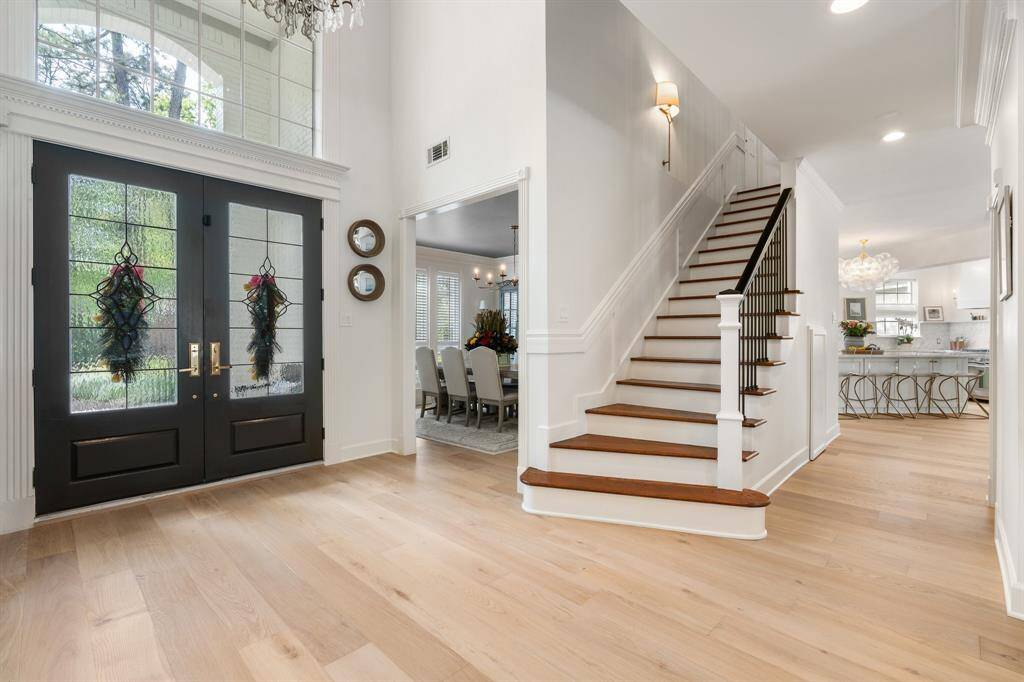 A wow-factor entry welcomes guests into a light and airy floor plan with generous updates and improvements throughout.