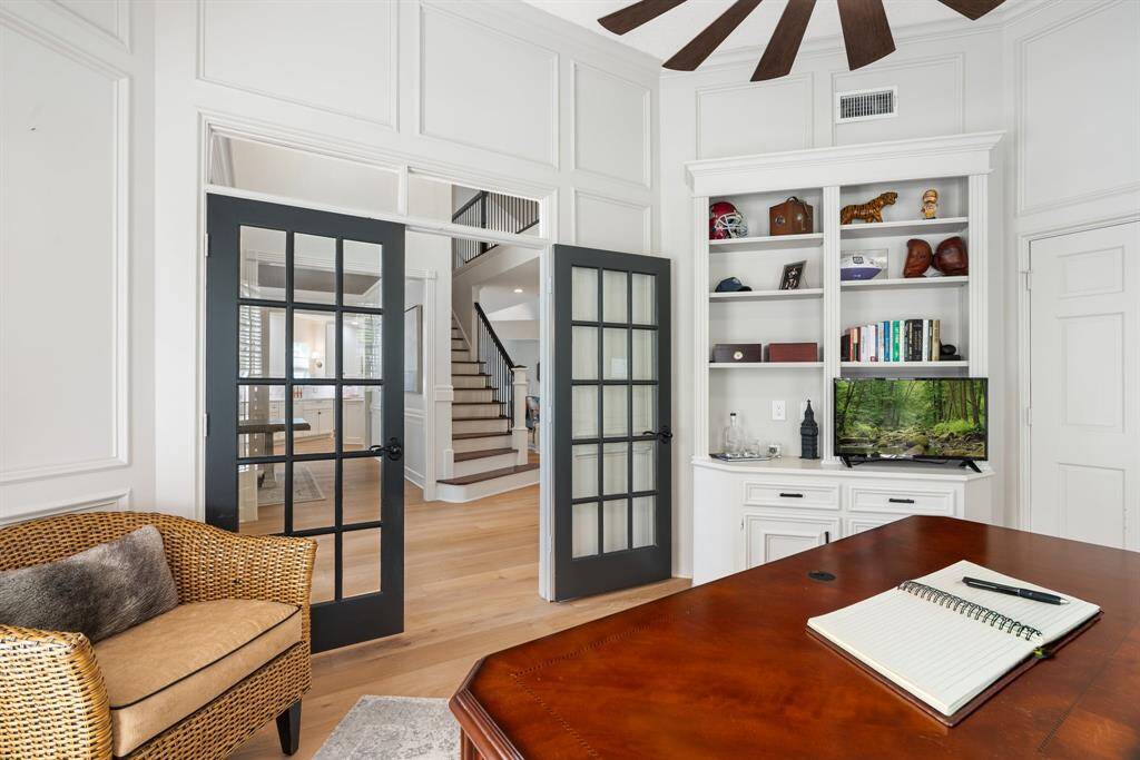 French doors open into the homes study with built-in storage, new ceiling fan and private access to the primary suite.