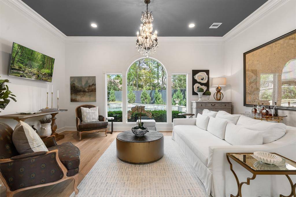 The formal living is a showstopper with inviting views of the back landscape.