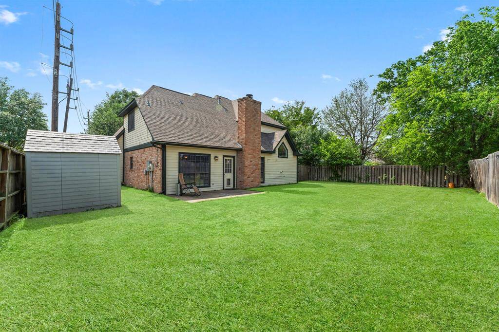 Sprawling backyard offers plenty of space for play or entertaining.