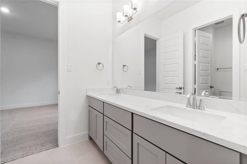 Bath 2 Boasts Double Sinks and is Attached to Bedrooms 2 and 3.