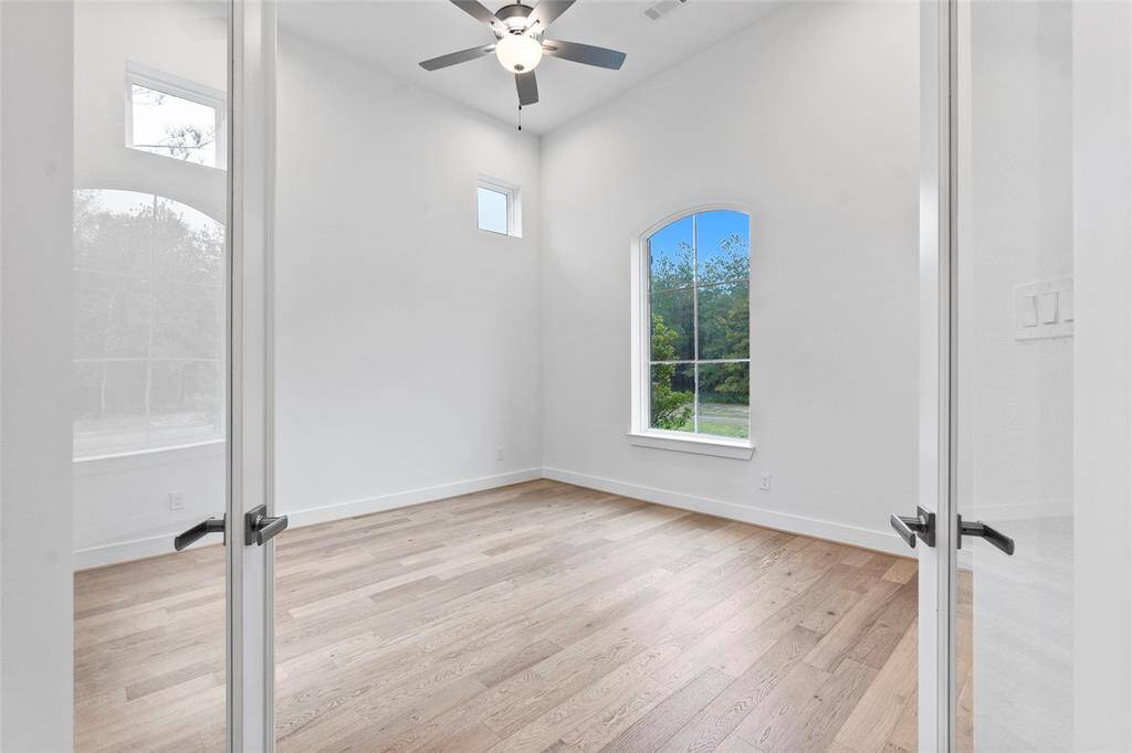 Double Doors to the Study/Home Office with Engineered Hardwood Flooring and Fan