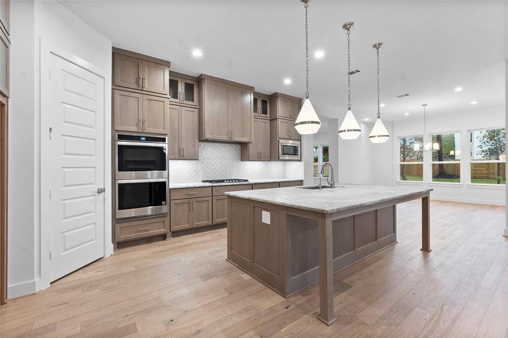 Cabinets to the Ceiling, Walk-in Pantry, and Double Ovens at the Kitchen