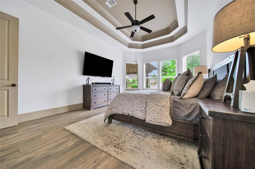 Primary suite overlooking backyard