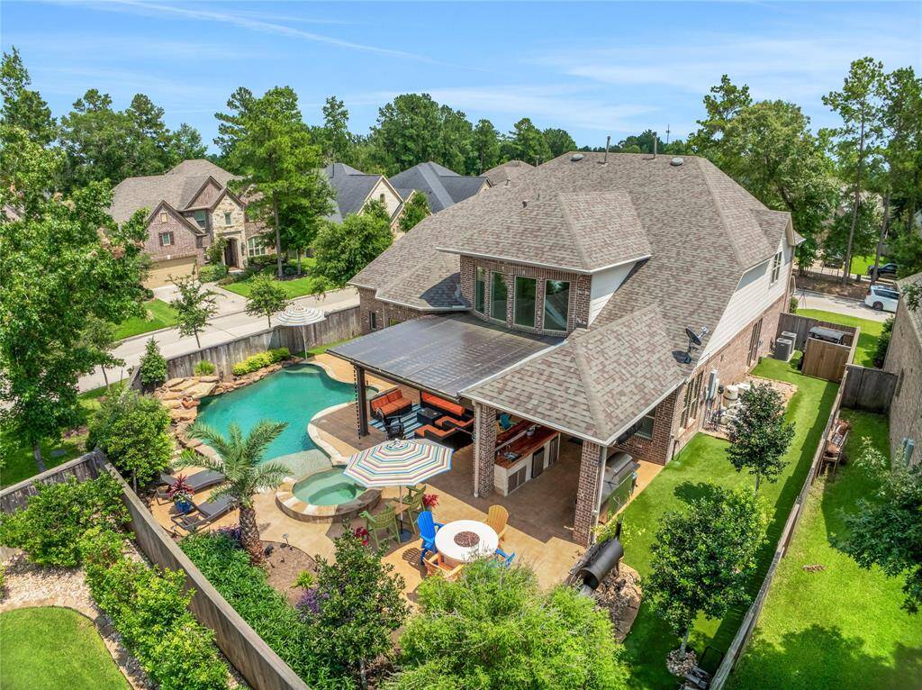 Oversized corner lot with lush landscaping.