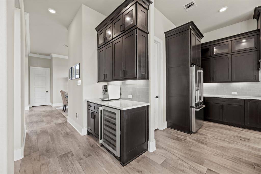 A built-in wine refrigerator offers a sleek and convenient storage solution, seamlessly blending into your kitchen while keeping your wines at the optimal temperature.