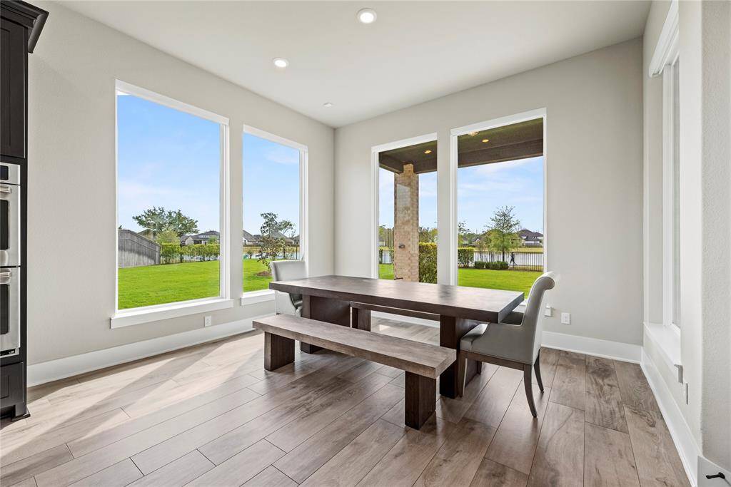 Dine in the kitchen eating area for views of the sprawling backyard! Tons of windows provide excellent sightlines and allow shimmering natural light to flood the home in luminosity.