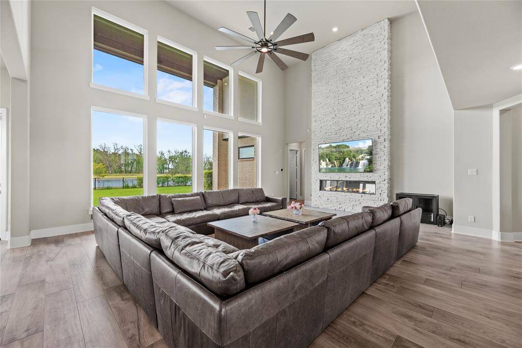 Welcoming and conveying warmth, the living room offers an inviting space for evening movies or holiday gatherings. Tune into your favorite streaming show, while admiring the cozy fireplace.