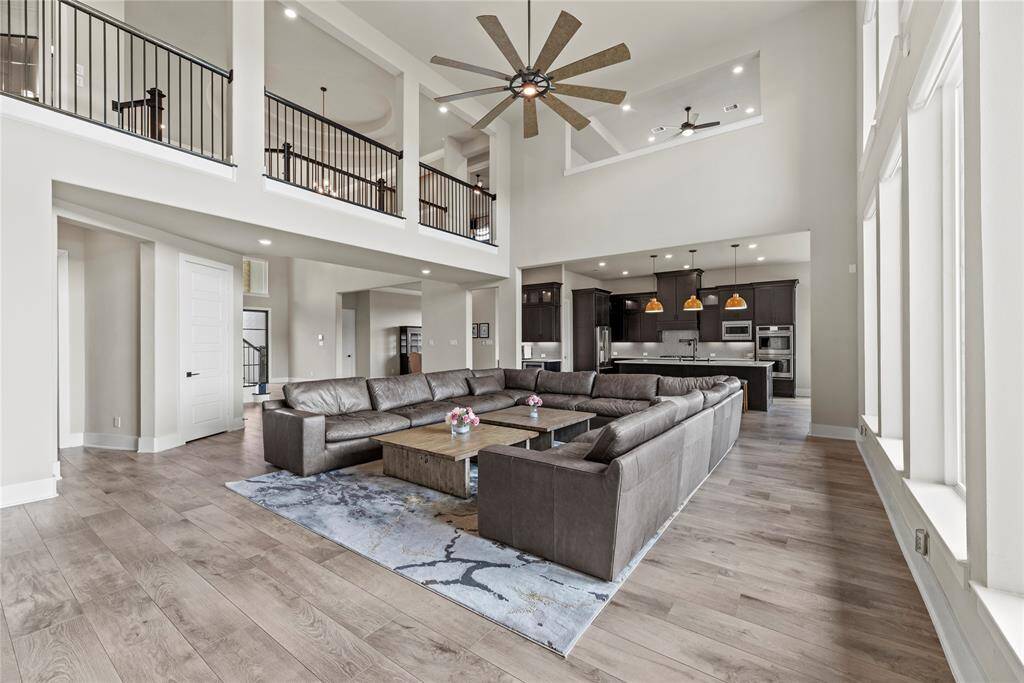The family room boasts several windows that flood the space with natural light and offer breathtaking views of the spectacular backyard!