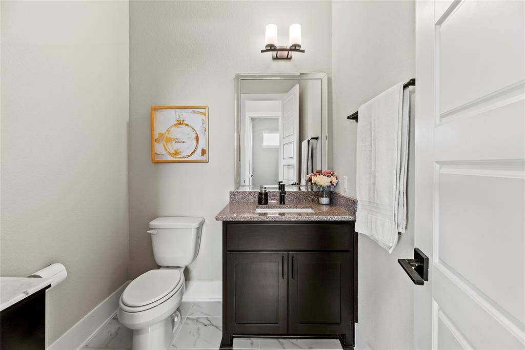 Hospitality is felt throughout the home and the powder room is no exception.