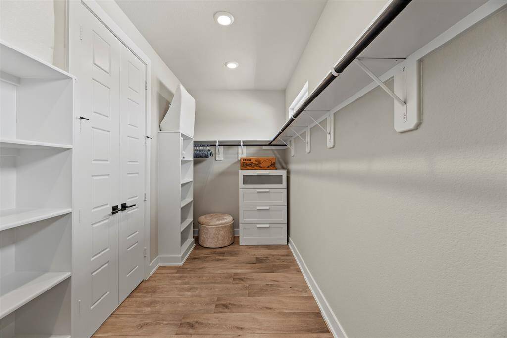 No matter how often you purchase new threads online or at the mall, this walk-in bedroom closet has space for all your new and favorite wares!