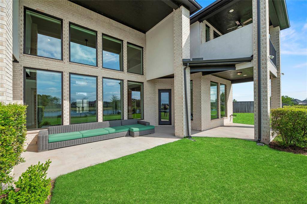 The wide patio has tons of space for al fresco dining. Chat with friends over cocktails, as the kiddos and dogs play in the fully fenced-in backyard.