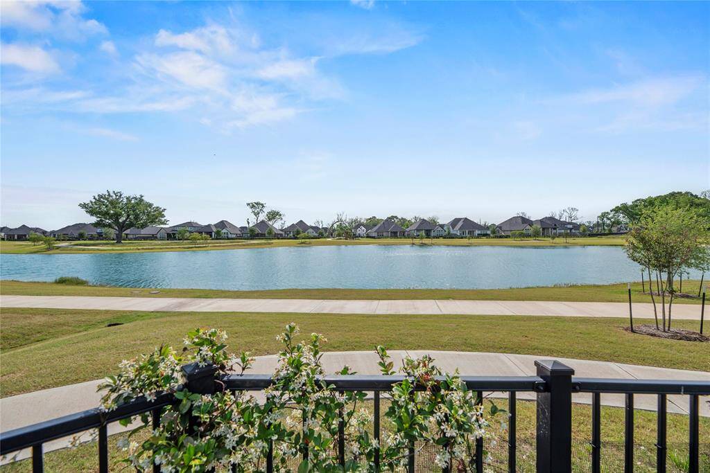 Enjoy panoramic lake views with over 200 feet of property backing directly to the water, all on an oversized cul-de-sac lot. This prime location also offers convenient access to a scenic walking and biking trail.