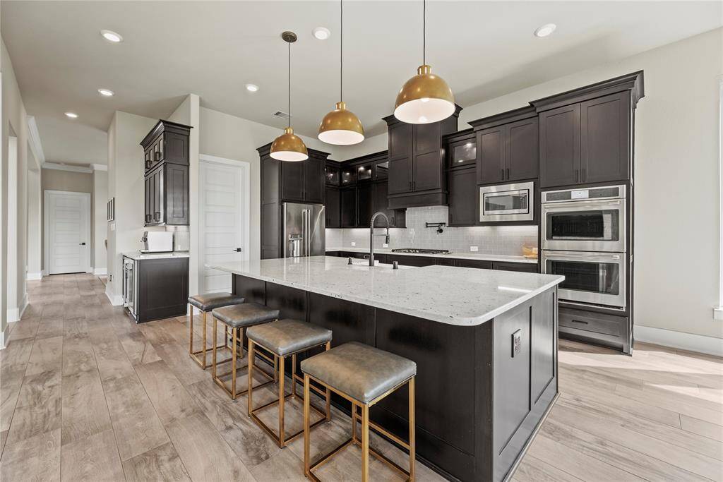 Imagine baking sugar cookies in the attractive and updated kitchen. Use the center island as a place to cut and decorate seasonal cookies with all sorts of sugar, sparkles, and candy!