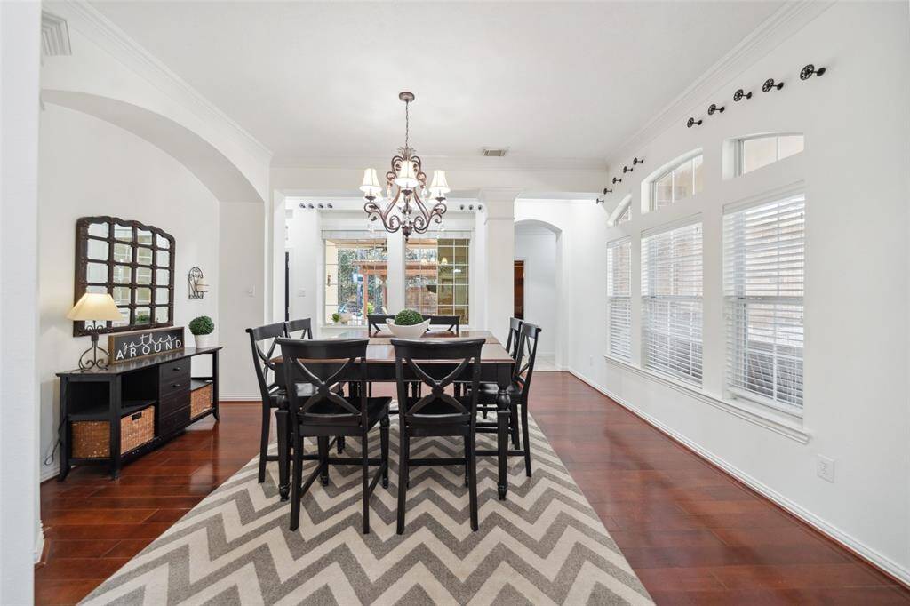DINING ROOM Looks out to the Outdoor Room & Outdoor Kitchen.  This home offers wonderful flow for indoor/outdoor living.