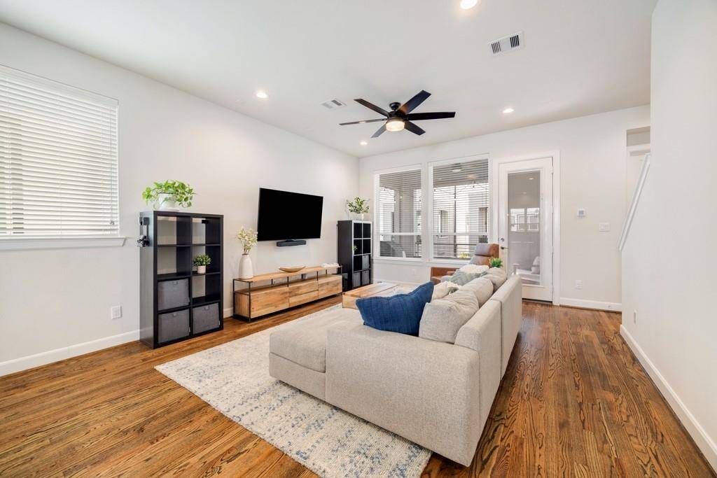 The spacious layout accommodates a designated dining area along with seating at the kitchen island.