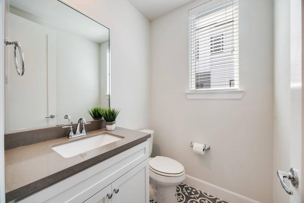 Alternate view of the primary suite showcasing its spacious layout and natural light.