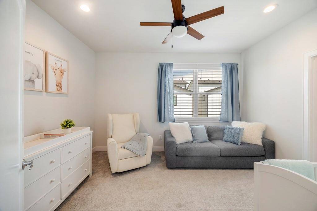The luxurious primary bath boasts double sinks, a soaking tub, and a spacious, oversized shower.