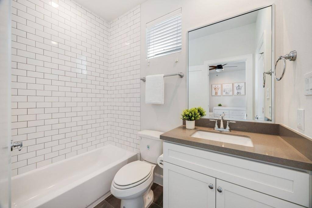 The spa-like primary retreat showcases a lavish soaking tub, offering the perfect place to unwind.