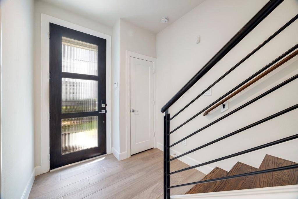 Alternate view of the first-floor bedroom highlights the closet and convenient kitchenette.