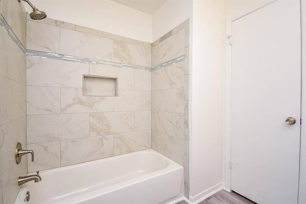 It is complete with a shower/tub combo, and a beautiful tile wall!
