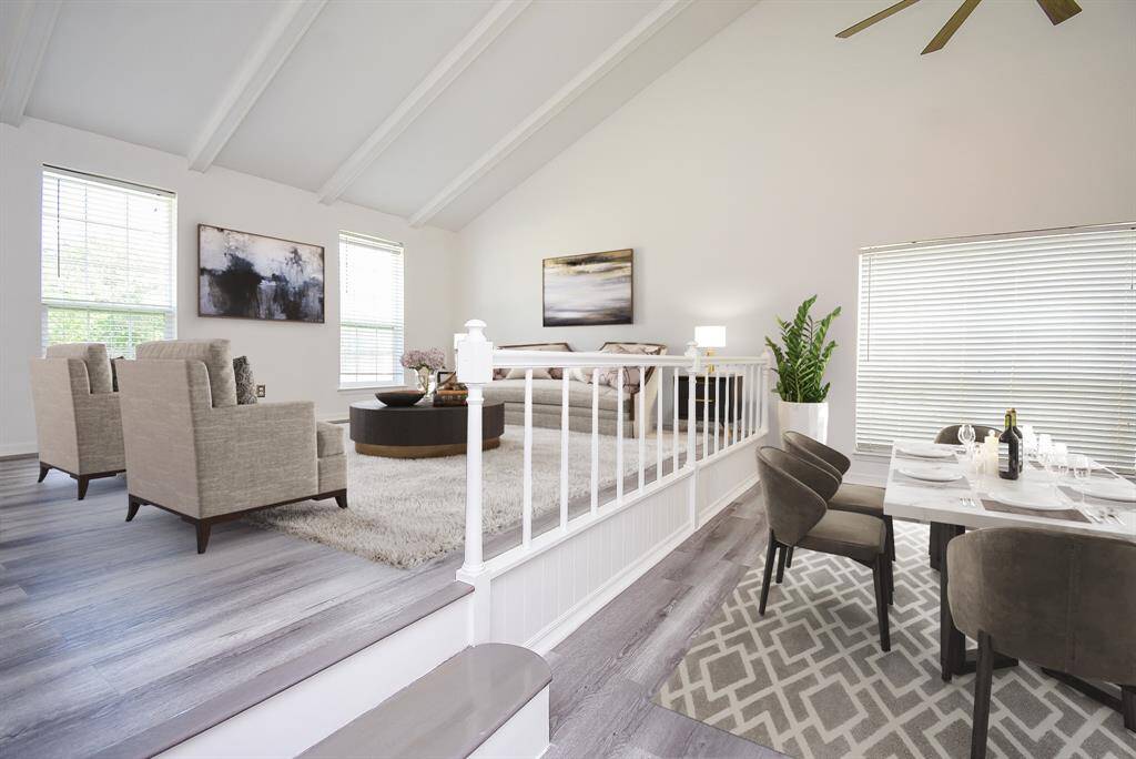 Virtually Staged: This living room is the perfect place to entertain family and friends as it offers easy access to your dining area!