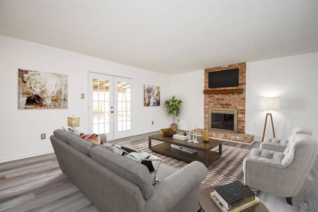 Virtually Staged: Cozy den offers the perfect hangout spot for movie nights, homework time, or a quiet place to relax together as a family.