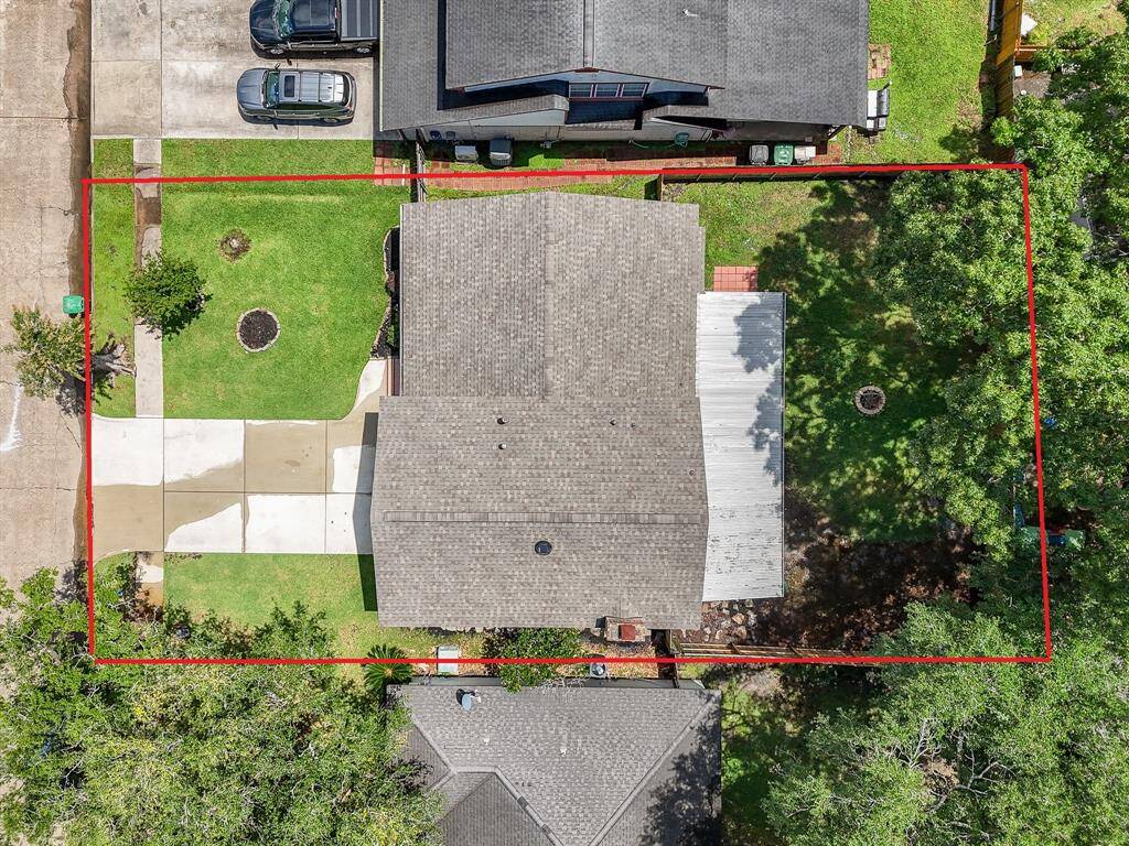 This aerial view showcases the beauty of this exceptional home, featuring a stunning new roof that enhances both its curb appeal and long-term value.