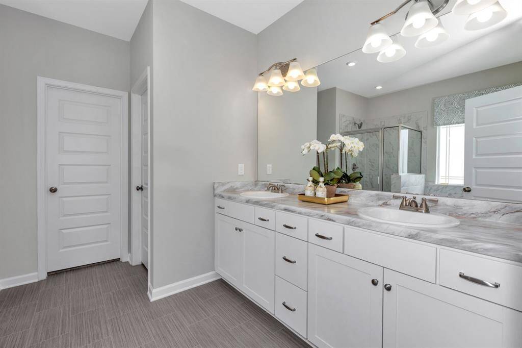 The McGinnis- Primary Bathroom with Dual Vanities.