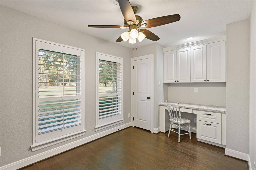 There is another flex-use room off of the master suite that could be used as an office space, an in-room nursery, an exercise room, a storage room, a craft space, or whatever you need. It offers a closet and a built-in desk station.