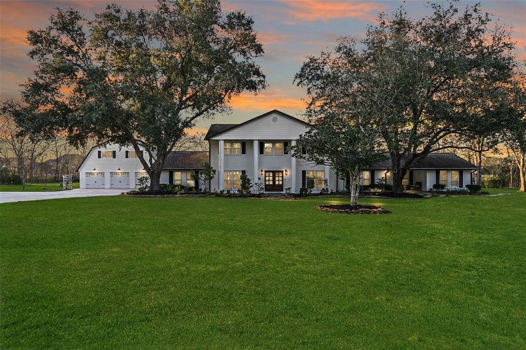 11 Windcreek is a property unlike any other in the city of Friendswood! Not only does it showcase 5000 square feet of fabulously updated living space, but it offers every amenity you can imagine. The barn-style garage on the left houses 3 garage spaces, an 800SF garage apartment, and tons more workshop, gym, or parking space.
