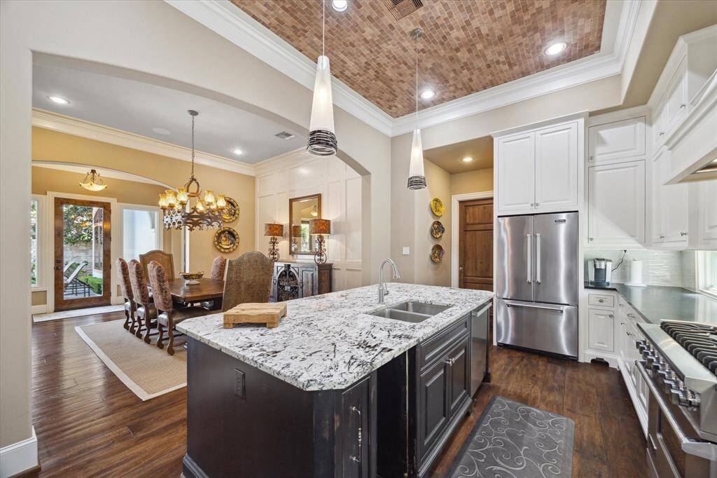Views the dining room, pool and living room all from the kitchen- the heart of the home!