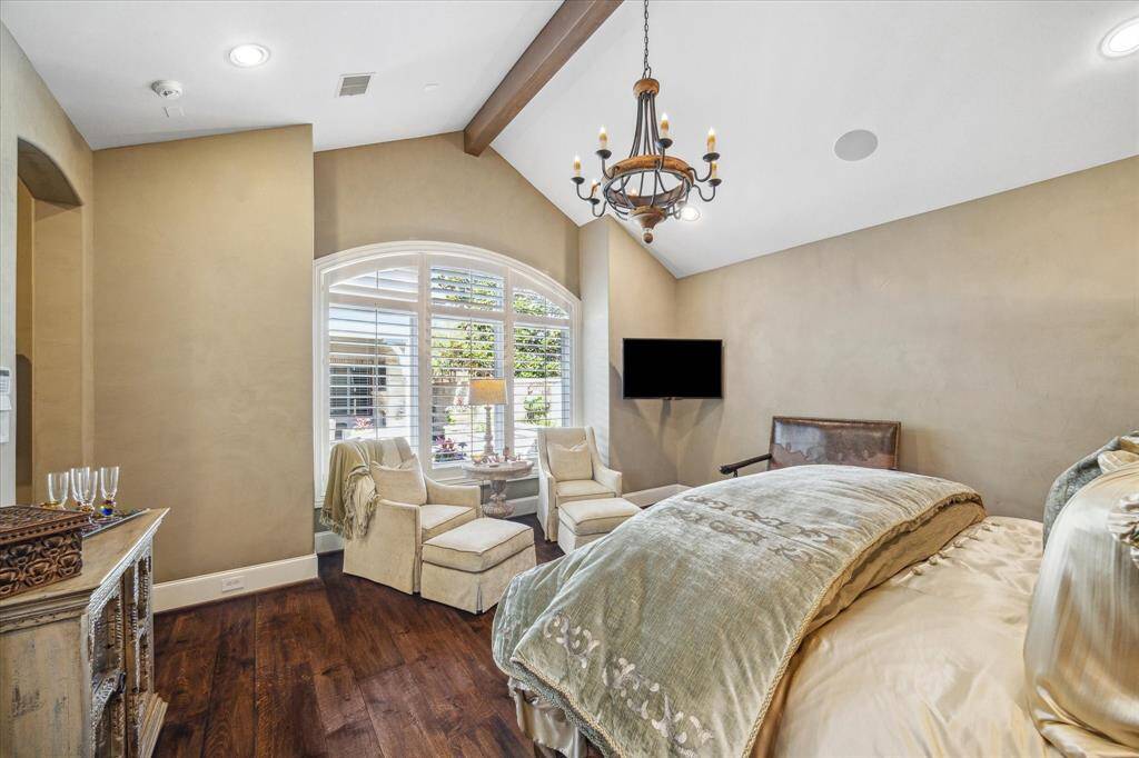 Custom Venetian plaster walls and large picture window with views of the amazing outdoor space are so fitting for this owners’ retreat.
