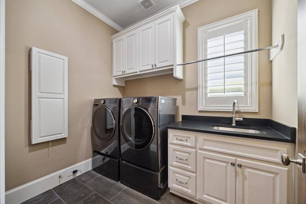 This laundry room checks all the boxes, AND it has direct access from the primary closet!