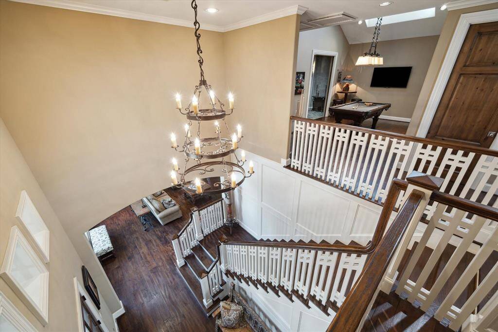 Atop the second floor landing, the wide stairs and custom railing are all the more appreciated and provides a bird’s eye view of this desirable home.