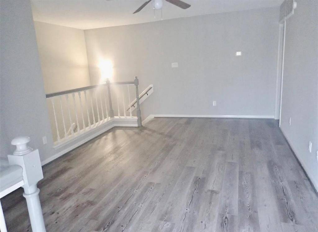 Bright, open area with modern flooring, ideal for versatile use and easy flow.