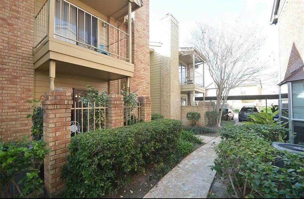Nestled in a charming setting, this inviting home offers a blend of comfort and style, surrounded by lush greenery and well-maintained pathways.