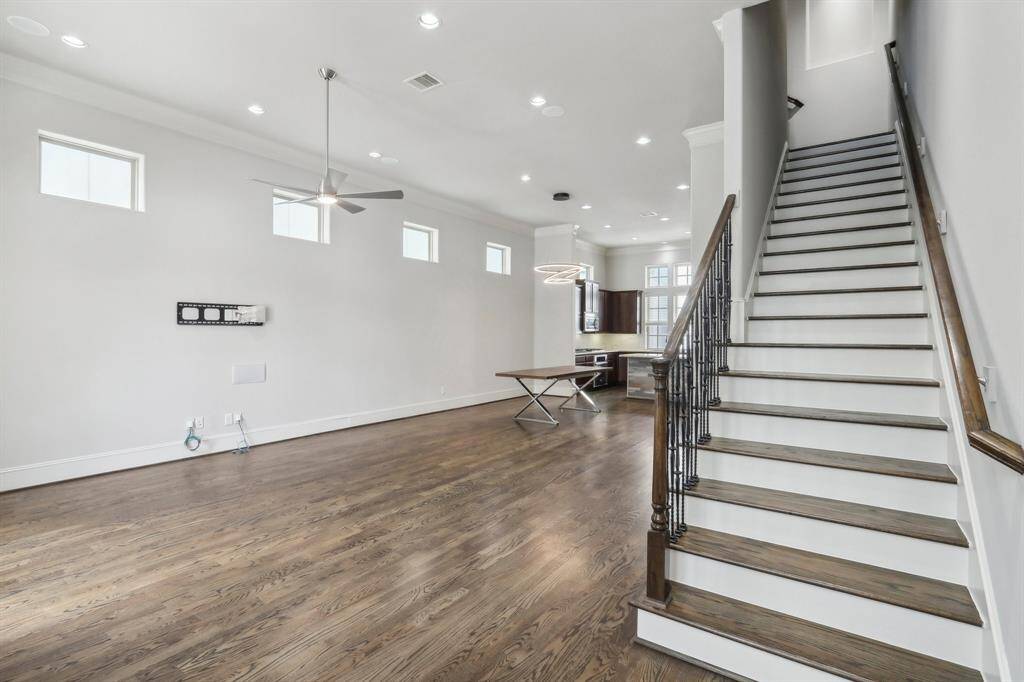Another view of the living room/dining room with kitchen