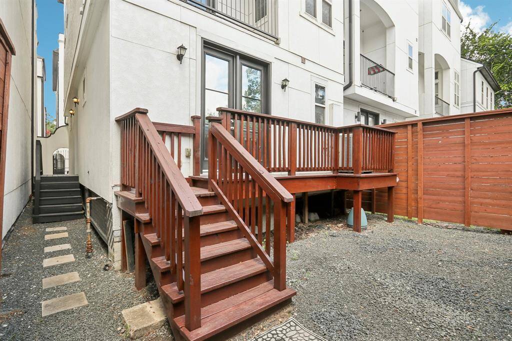 1st floor fully stained fenced backyard with deck.