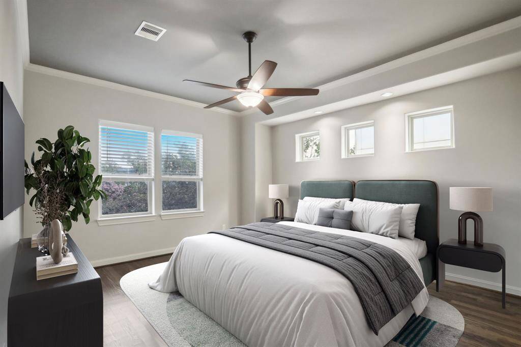 Virtually staged master bedroom on 2nd floor with long walk in closet with built ins and en suite bathroom.