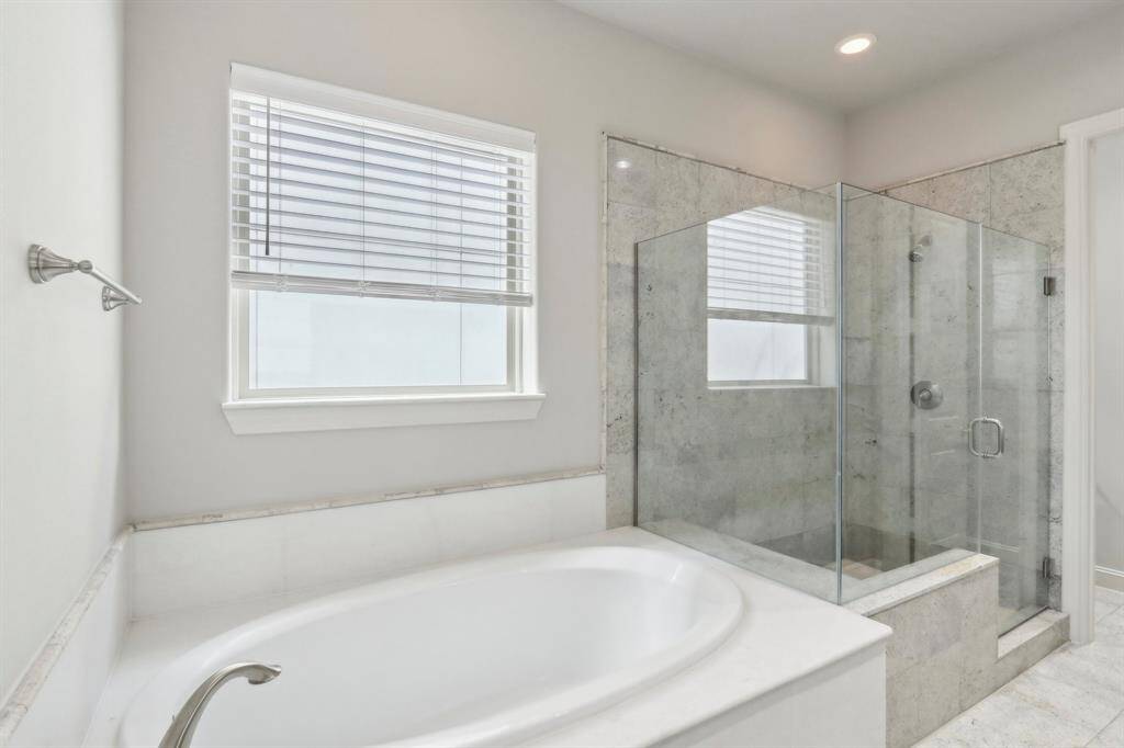 View of the tub and the shower.