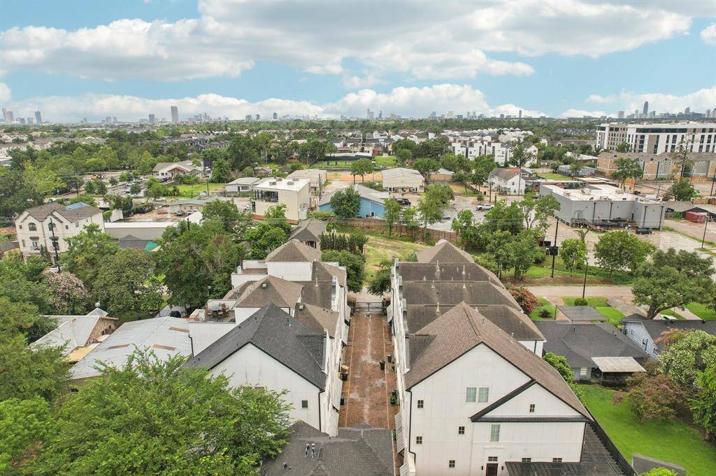 Aerial view of the gated community with views of downtown.
