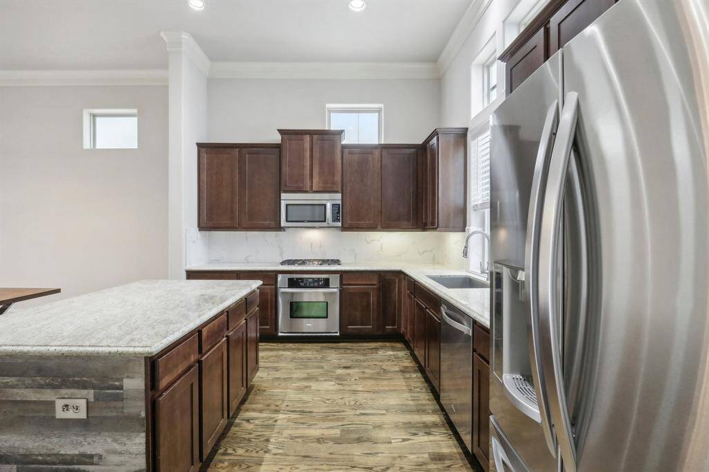 Another view of this fabulous kitchen. Wood floors throughout. Great for entertaining guests while you cook.