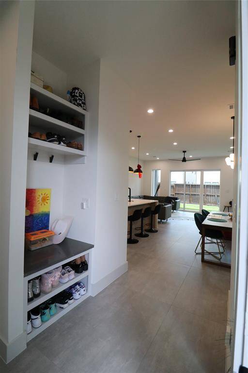 Notice mud room with a solid surface bench