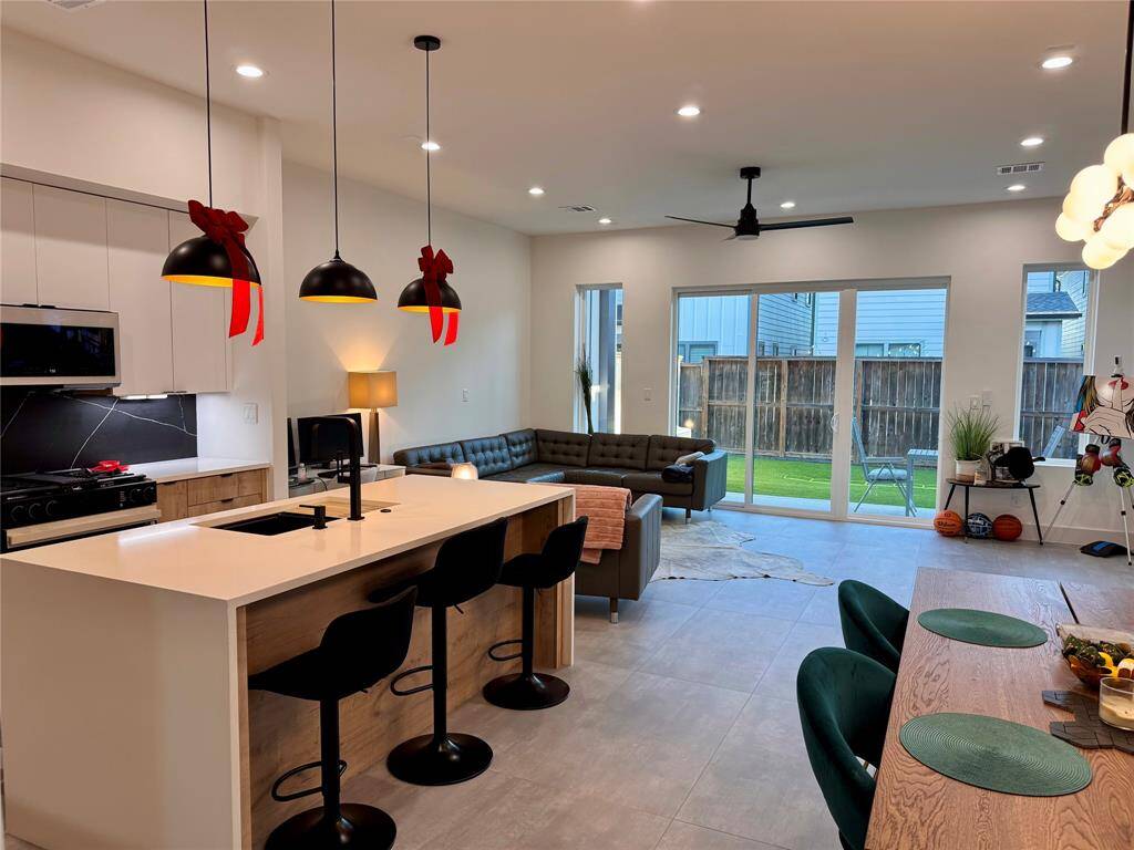 Natural Light Masterpiece: Oversized windows and patio doors from Elevate, a Velux skylight, and east-facing window in the primary shower bring natural light into every corner of the home.