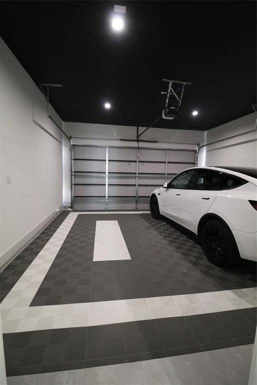 Garage Excellence: Extra-deep 21-ft garage fits a full-size truck or SUV with ease. Features include dual EV chargers, custom flooring with drainage, R16 insulated walls, smart WiFi lighting, and Amazon-compatible garage delivery.