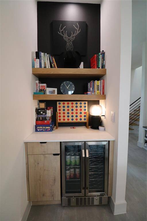Beverage Center: Custom oak shelving and built-in cooler for your wine or drinks—a $2,000 upgrade you won’t find next door.