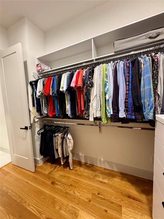 Primary closet with built in soft-closing drawers and electrical outlets for your ironing board!100% LED, color-changing, and dimmable lighting, oversized remote fans with integrated lighting, and Alexa-compatible dimmer switches throughout. Reading lights in 2 bedrooms, Cat-6 wiring