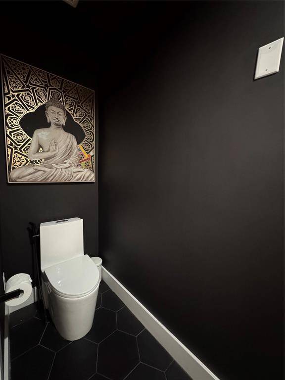 Designer Bathrooms: Swiss Madison one-piece toilets with bidet, rain showers with handhelds and niche storage, plus backlit and front-lit minimalist mirrors—over $5,500 in thoughtful bath upgrades.