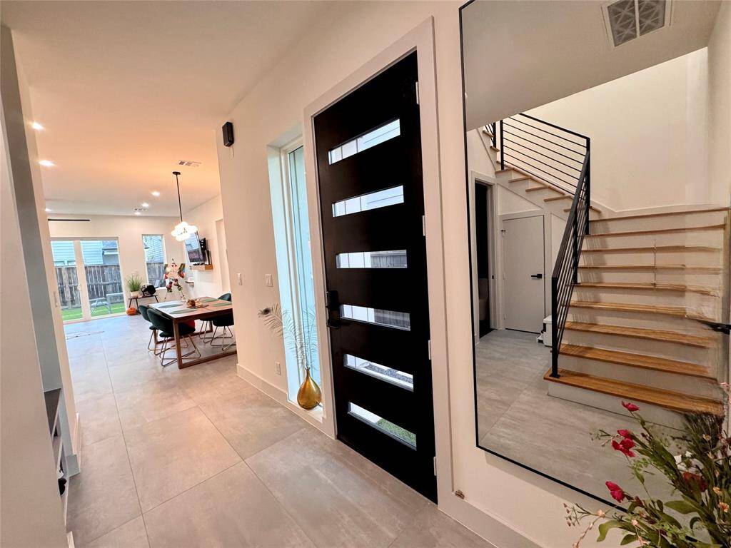 First floor has massive 24x48 tiles- less grout to clean and more monolithic look. Moderns at its best!